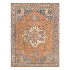 an orange, blue and beige rug with ornate designs on the bottom half of it