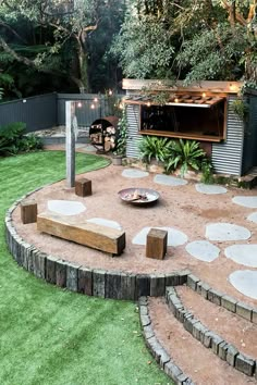 an outdoor grill and seating area in a backyard