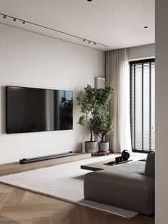 a large flat screen tv mounted to the side of a wall in a living room