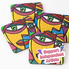 four coasters with colorful faces and the words support independent artists