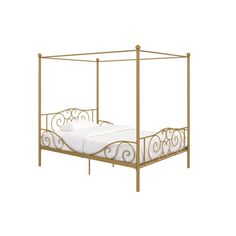 a gold metal bed frame with white sheets