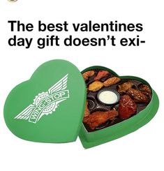 a green heart shaped box filled with assorted candies in it and the words, the best valentine's day gift doesn't exi