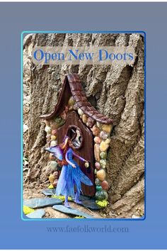 an open new door is shown in front of a tree with a fairy house on it