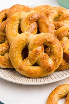 a white plate topped with pretzels on top of a table