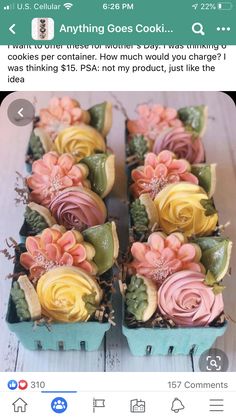 some cupcakes with flowers in them are on a table and there is an instagram