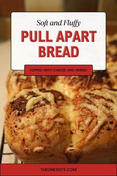 a close up of bread on a rack with text overlay that reads, soft and fluffy pull apart bread topped with cheese and herbs