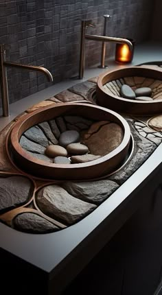 two sinks made out of rocks and pebbles