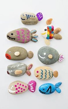 some rocks with different designs on them and one is painted to look like an ocean animal