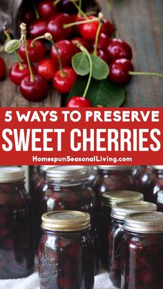 jars filled with cherries sitting on top of a table