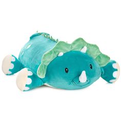 a stuffed animal that is laying down on the ground