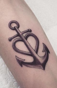 an anchor and heart tattoo on the arm