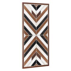 a brown and white wall hanging on the side of a wooden panel with an arrow pattern