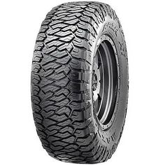 an all terrain tire on a white background