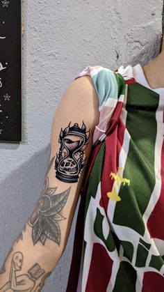 a person with a tattoo on their arm