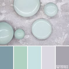 the color scheme is pale blue, green and gray with white plates on top of each other