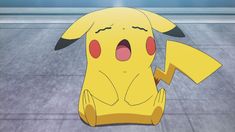 a pikachu sitting on the ground with its mouth open and eyes wide open