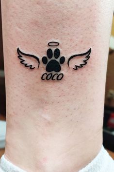 dog paw tattoo with angel wings, dog memorial tattoos Dog Rip Tattoo Ideas, Dog Paw With Wings Tattoo, Tattoos And Prices, Paw Print Tattoos Dog, Tattoo Ideas Female Dog Paw, Angel Paw Print Tattoo, Puppy Paw Tattoo Ideas, Dog Paw With Angel Wings Tattoo, Puppy Paws Tattoo