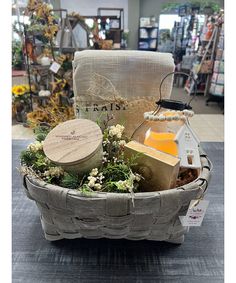 a basket filled with lots of different items on top of a table in a store