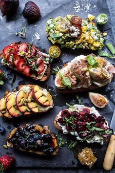 an assortment of grilled fruits and vegetables on a slate platter with a knife