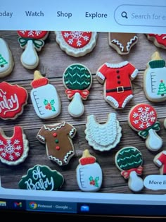 a computer screen with some decorated cookies on it's display area and an image of santa clause