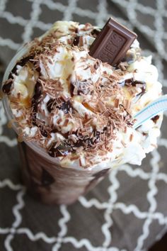 a cup filled with chocolate and whipped cream