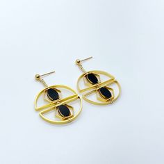 The earrings are light weight and are made to rotate and reposition with movement. The earrings consist of black oval shaped beads. They are new old stock vintage German glass beads that are framed with 24K gold. The beads were hand pressed during the 1920s-1960s. No two beads are exactly alike. These beads are no longer in production thus making them rare and collectible.  Due to the nature of this jewelry, it is unique.  Product Detail:  24K gold edge German vintage glass Bead 24K gold-plated brass metals gold-filled finding and ear wire   *Our jewelry has maximum protection for anti-tarnish and is made for extended wear. You may gently polish your jewelry with a soft jewelry cloth using water and a little soap to restore their brighter finish. Do not rub the vintage glass beads too hard Soft Jewelry, Beads Art, April Birthstone Jewelry, March Birthstone Jewelry, Deco Earrings, Forever Jewelry, Zodiac Jewelry, Art Deco Earrings, Pearl Jewellery Earrings