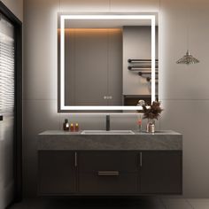 a bathroom with a sink, mirror and lights on the wall above it's counter