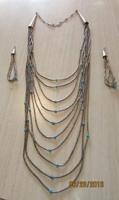 "Sterling liquid silver and turquoise heshi 10 strand waterfall necklace. The shortest strand will be 16\" long and the shortest 24\" long when worn with the extender as is. You can shorten the necklace by hooking into a different link if needed. Good condition with some patina. A pair of earrings 2 1/2\" long are included. Shipped by US first class mail. BDS-8" Waterfall Necklace, Liquid Silver, Garnet Pendant, Key Pendant, Tucson, Link Bracelets, Turquoise Necklace, Diy Jewelry, Jewelry Sets