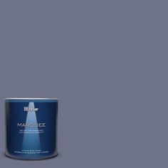 a white paint can with the words marjoie on it and a blue tin