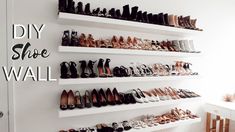 there are many pairs of shoes on the wall in this shoe rack that is built into the wall