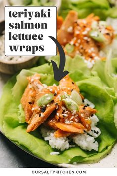 lettuce wraps with teriyaki salmon and white rice in them on a plate