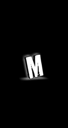 the letter m is made up of white letters on a black background, and it appears to be dark