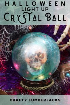 a crystal ball with a skull in it on top of a christmas tree