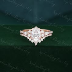 an engagement ring set with a pear shaped diamond