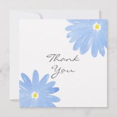 a card with blue daisies on it