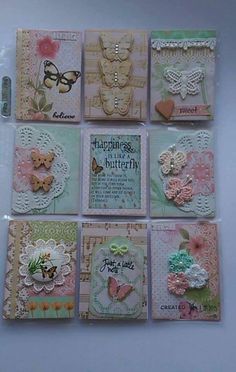 many different cards with butterflies and laces on them, all in pastel colors