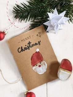 a christmas card with an ornament on it next to ornaments and a star