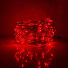 red christmas lights on a dark surface