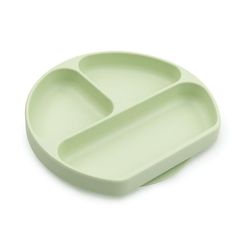 a green plate with two compartments on it