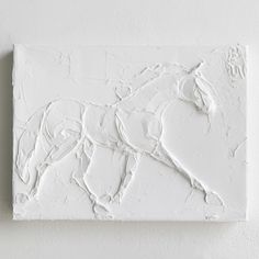 a white horse is painted on the wall