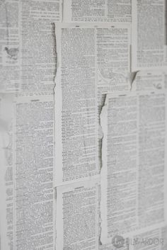 an old newspaper wallpaper with torn up pages