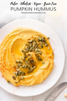 the hummus is topped with pumpkin seeds