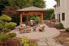 an outdoor patio with seating and gazebo