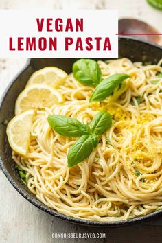 vegan lemon pasta in a skillet with basil and lemon slices