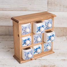 a wooden box with blue and white tiles on it