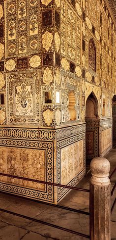 an intricately decorated building with columns and arches