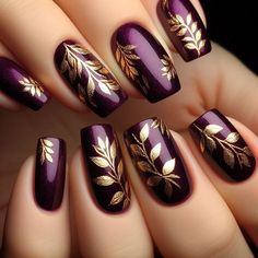 A rich amethyst base with gold-stamped leaf patterns scattered across the nails. The leaves are small and detailed, giving a delicate, elegant appearance. The gold stamping adds a metallic shine that complements the deep purple, creating a luxurious fall design. Purple Nails With Leaves, Purple And Gold Fall Nails, Fall Leaf Nail Designs Autumn, Autumn Purple Nails, Dark Plum Nails Designs, Purple Pumpkin Nails, Fall Nail Designs Purple, Autumn Nails Purple, Gold Leaf Nail Designs