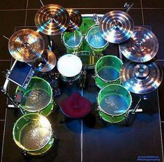 an overhead view of a set of drums and cyl's on a tile floor