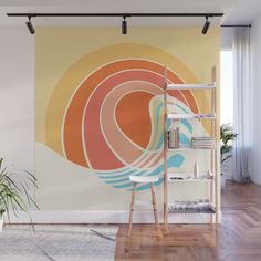 an abstract wall mural with colorful circles in pastel colors on a white background and wooden flooring