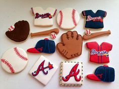 decorated cookies are arranged in the shape of baseballs, mitts, and gloves